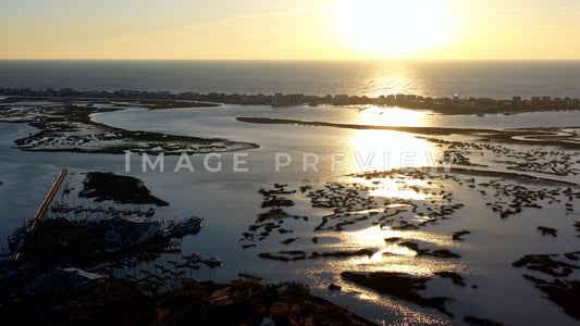 4k Still Frame - Murrells Inlet, SC aerial view of sunrise over salt water marsh and marina