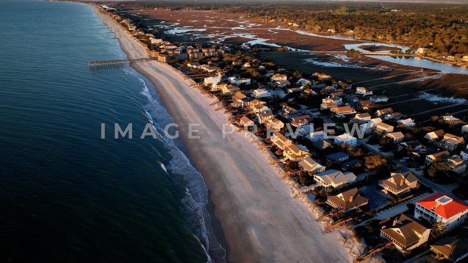 4k Still Frame - Pawleys Island, SC aerial view of coastline in morning light with pier