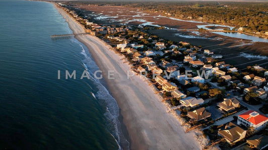 4k Still Frame - Pawleys Island, SC aerial view of coastline in morning light with pier