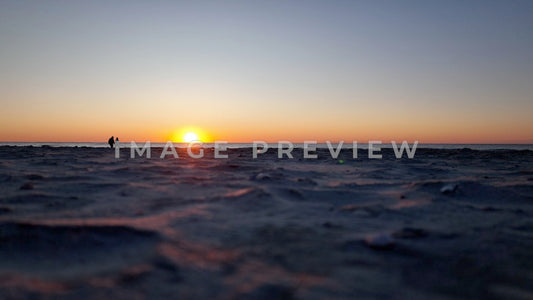 4k Still Frame - Pawleys Island, SC sunrise on the beach with couple walking