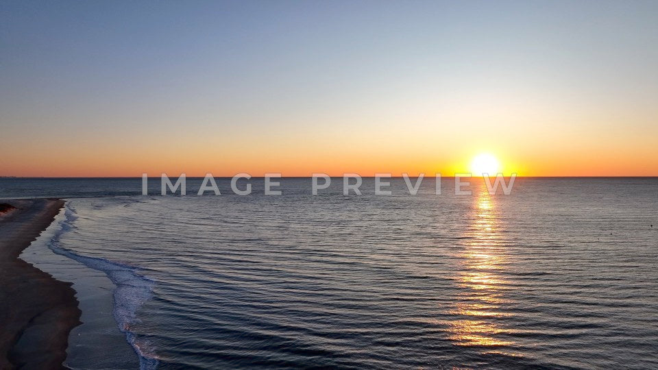 4k Still Frame - Pawleys Island, SC sunrise on the beach with coastline