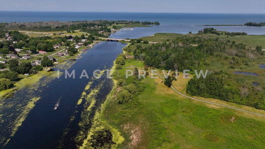 4k Still Frame - Braddock Bay, NY boat traveling up river from Lake Ontario past wetlands