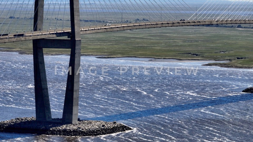 Brunswick, GA river flowing under Sydney Lanier Bridge past coastal wetlands