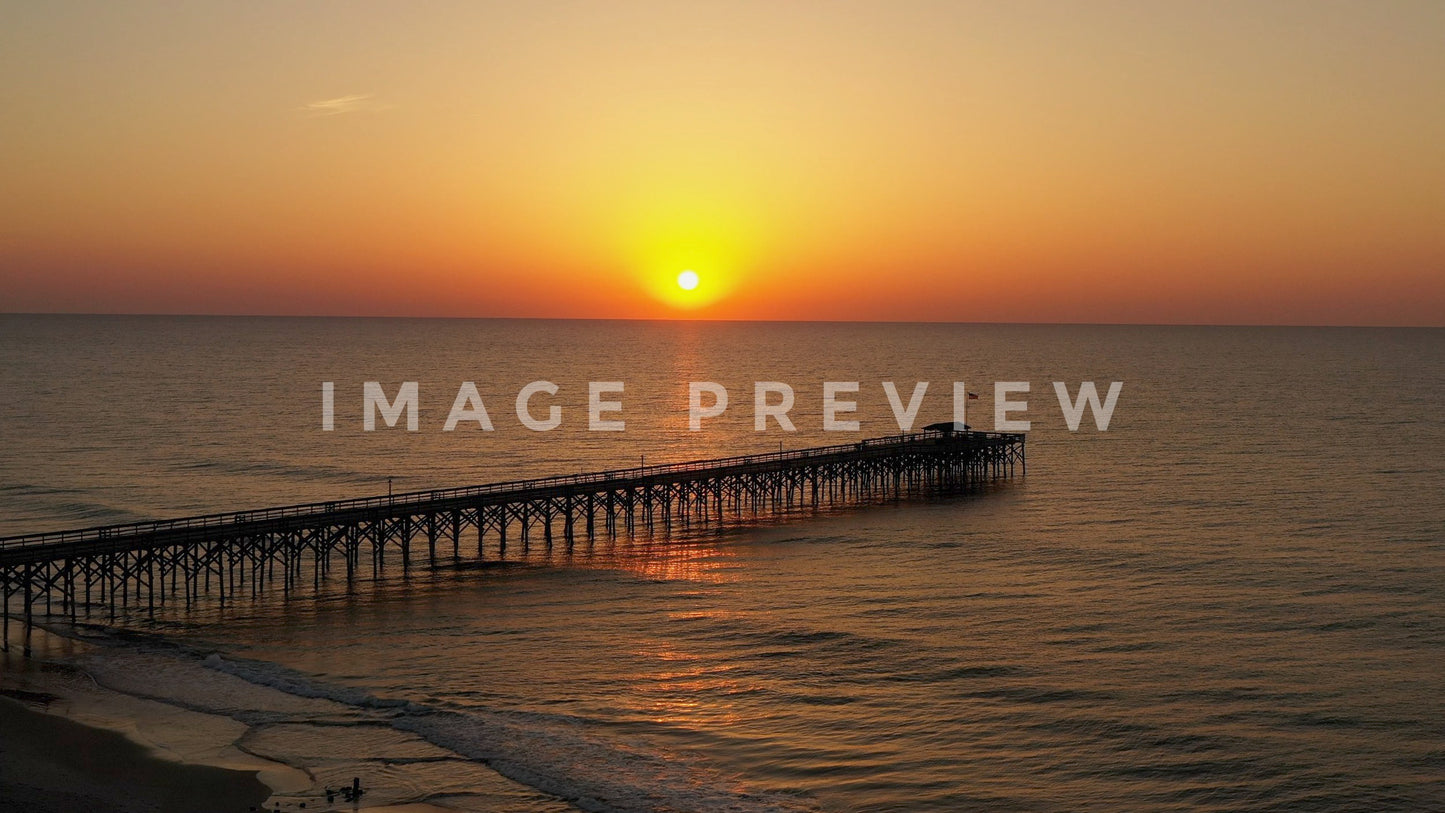 stock photo sunrise over fishing pier pawleys island sc