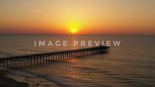 stock photo sunrise over fishing pier pawleys island sc
