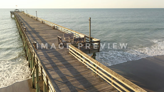 stock photo fishing pier in morning light at Pawleys Island SC