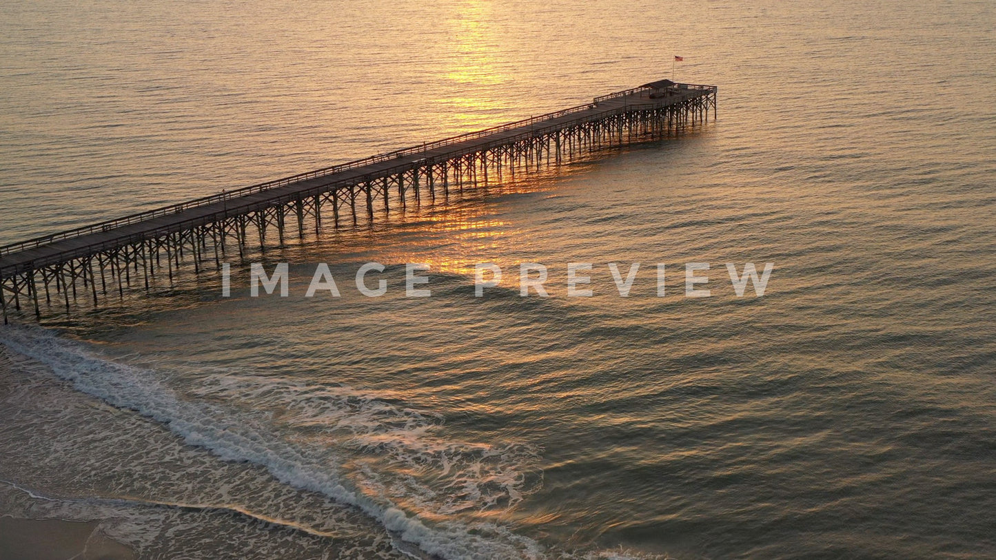 4k Still Frame - Pawley's Island, SC fishing pier on beach at sunrise