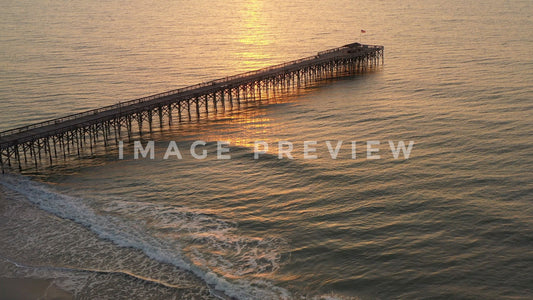 4k Still Frame - Pawley's Island, SC fishing pier on beach at sunrise