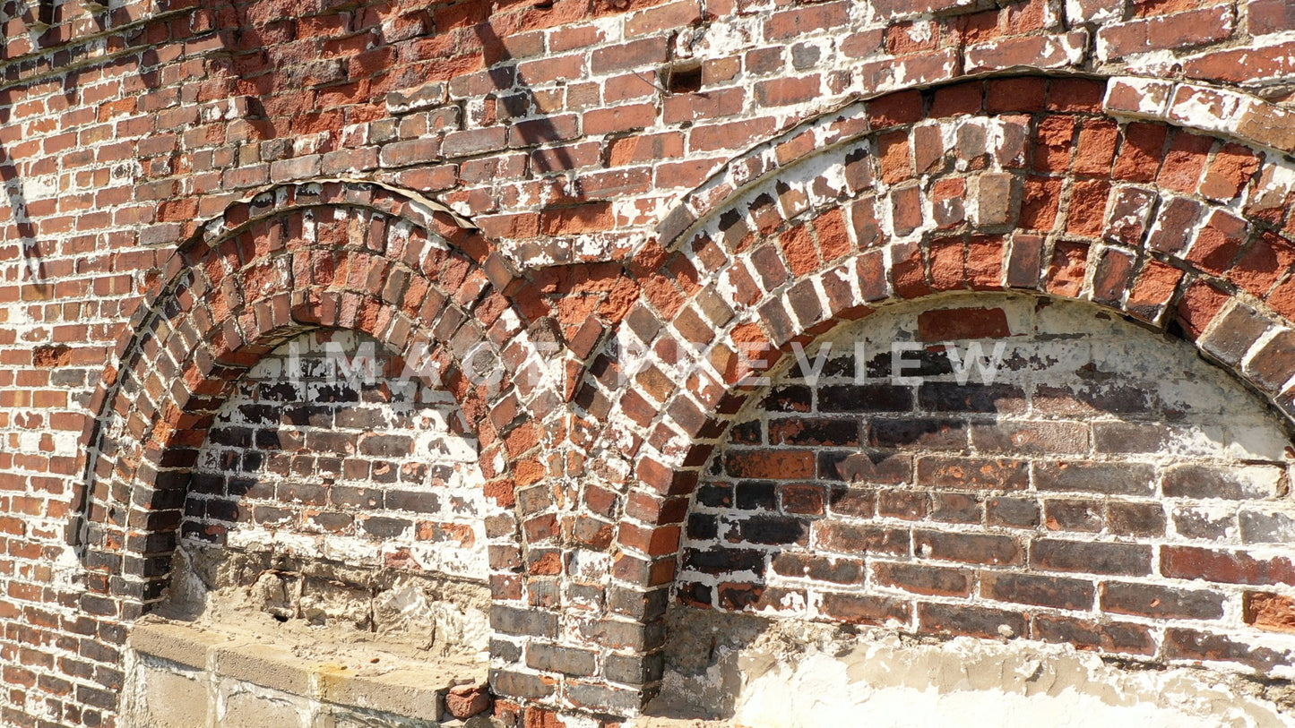 stock photo crumbling brick on old buidling