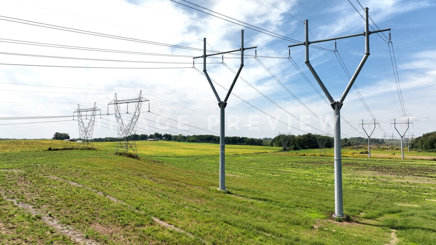 stock photo electric power towers in field