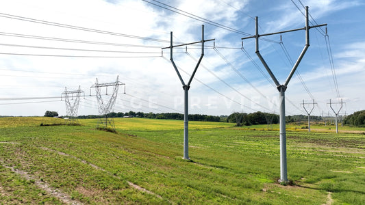 stock photo electric power towers in field