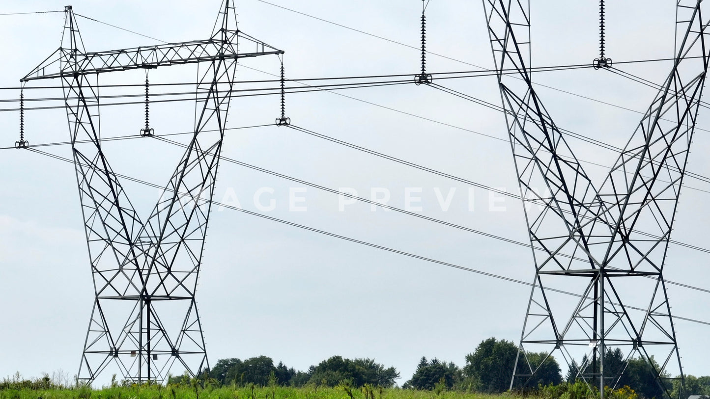 stock photo electric power towers in field
