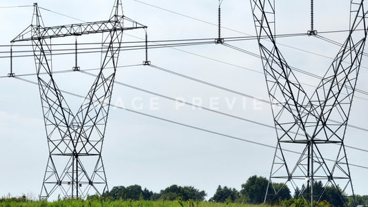 stock photo electric power towers in field