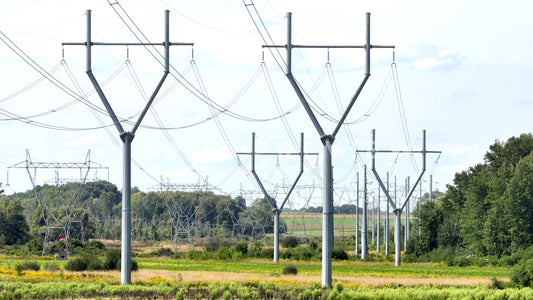 stock photo electric power towers in field