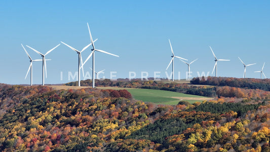 stock photo wind turbines on hillside