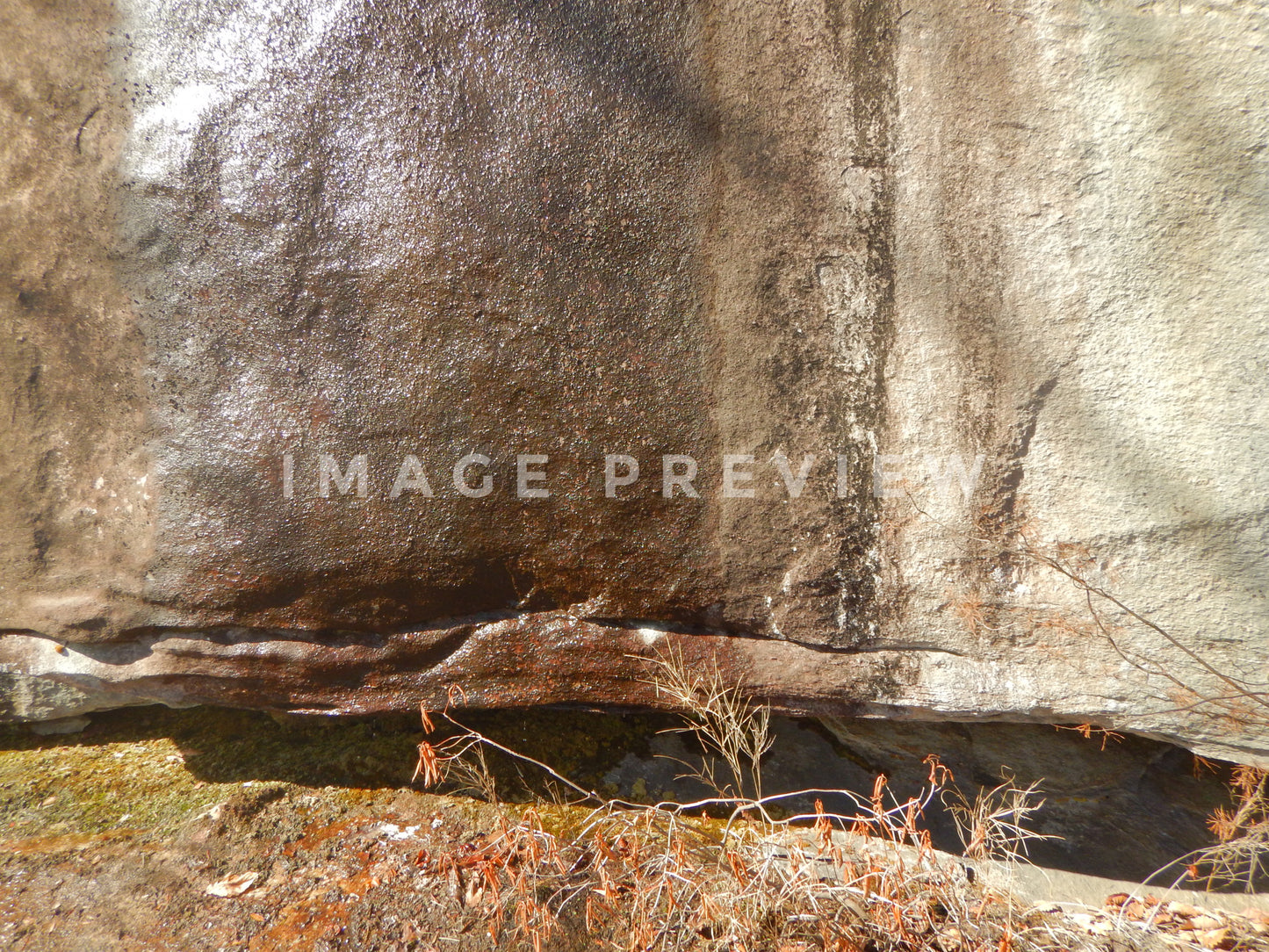 Photo - Rock wall on cliff side with moisture