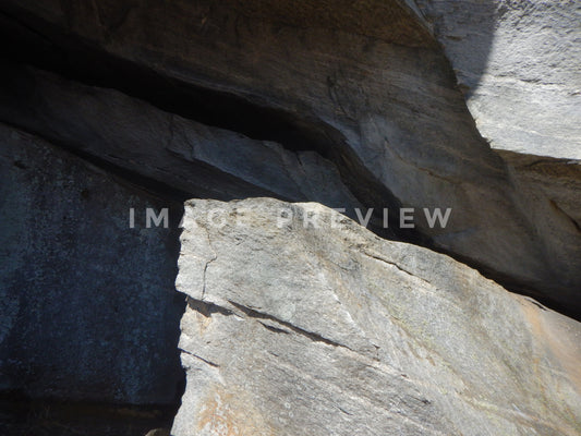 Photo - Rock formation in shadow on mountainside