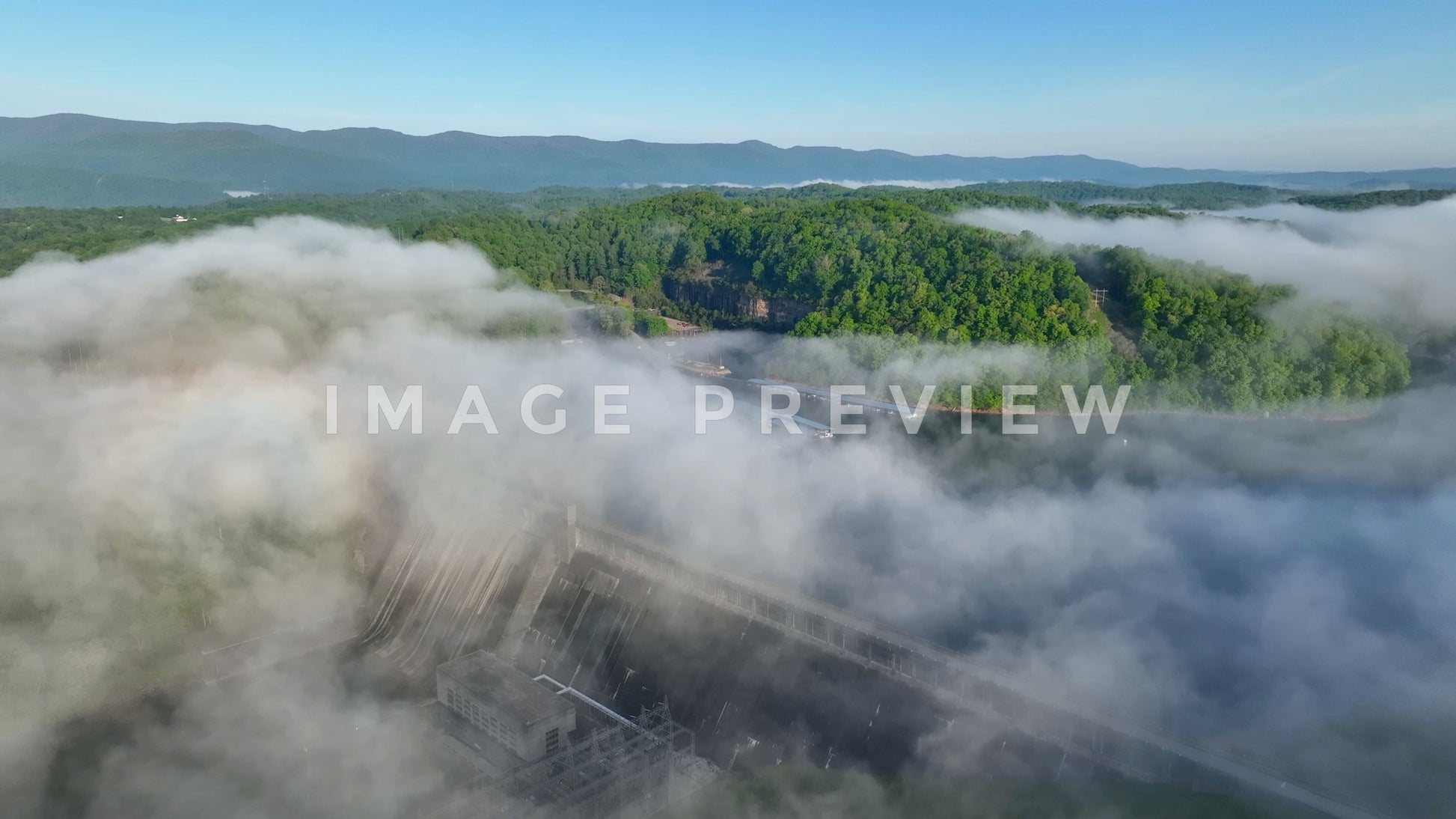 stock photo morning fog over Norris Dam in Tennessee