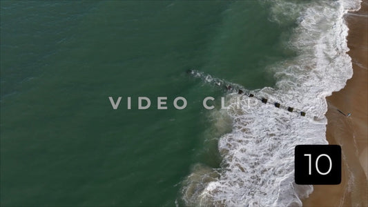 CLIP 10 - Outer Banks, NC looking down on breaking waves with person on beach