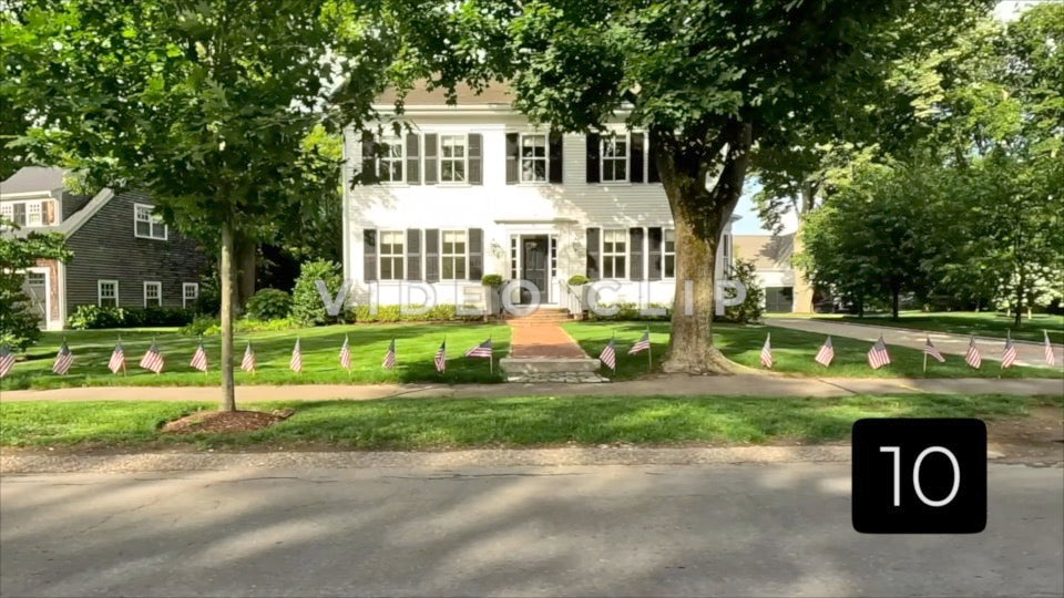 CLIP 10 - Boston, MA street view of residential homes with American Flag celebrating Memorial Day Holiday