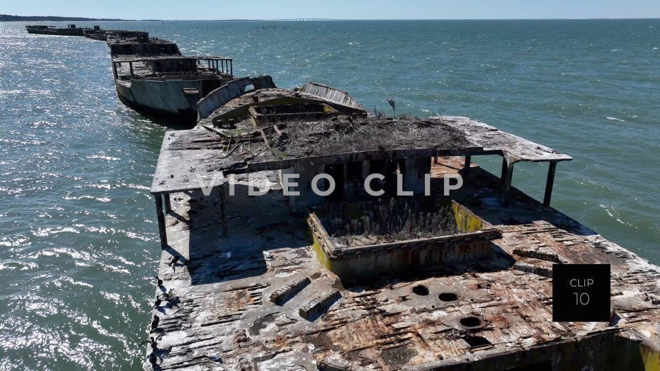 CLIP 10 - Kiptopeke Concrete Ships, VA low flight over top as sun shines on water