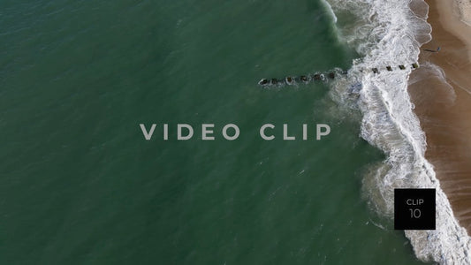 CLIP 10 - Outer Banks, NC looking down on breaking waves with person on beach