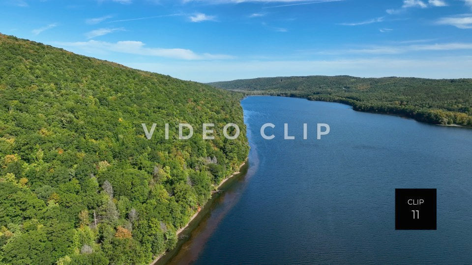 Stock video CLIP 11 - Canadice Lake, NY Finger Lake beside green hillside in early Fall season