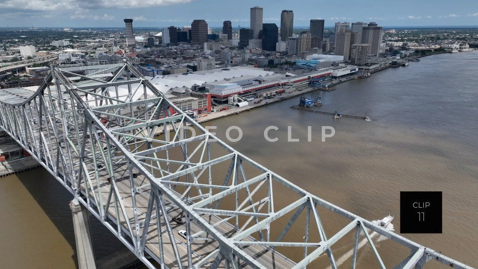 CLIP 11 - New Orleans, LA flying over Crescent City Connection Bridge as boat passes under