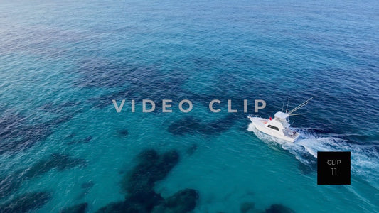 CLIP 11 - Isla Mujeras, Mexico fishing boat cruising over clear Caribbean water