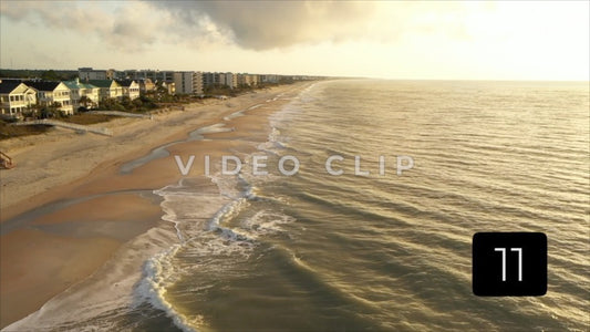 CLIP 11 - Litchfield Beach, SC aerial looking down the shoreline with homes and hotels during beautiful morning