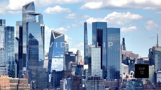 CLIP 12 - New York, NY shimmering glass towers refecting blue sky and clouds