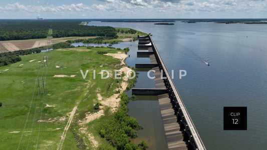 Stock video CLIP 12 - Lake Marion, SC slow turn over back side of Santee River Dam as boat motors by