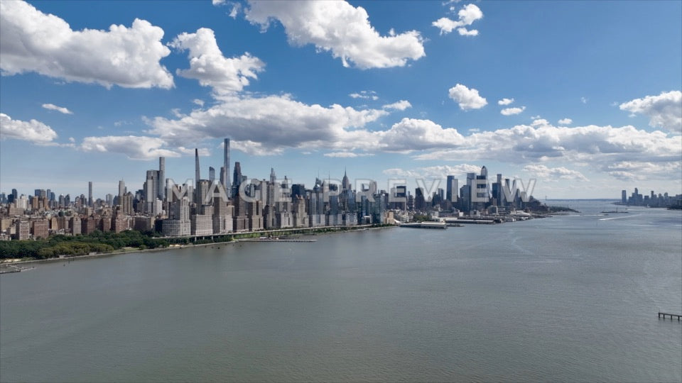 Photo - New York City, NY Blue sky and clouds over city skyline with Hudson River