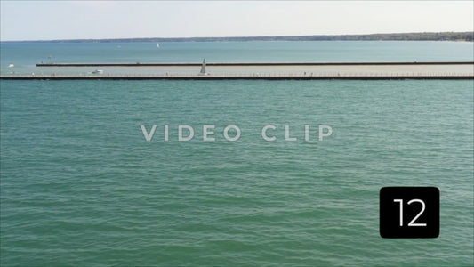 CLIP 12 - Rochester, NY Vol. 5 - Boats motoring on Genesee river past Charlotte Pier at Ontario Beach Park