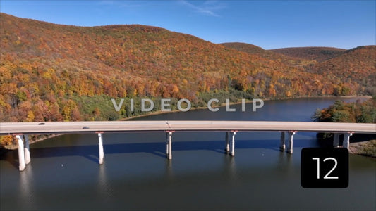 CLIP 12 - Tioga Dam and Reservoir, PA cars traveling over reservoir with mountains