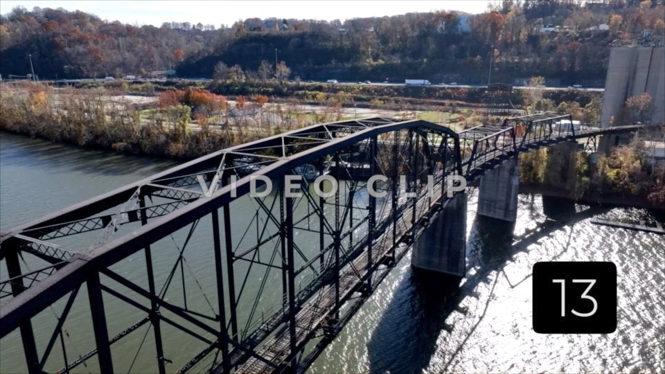 CLIP 13 - Charleston, WV slow reverse flight by train bridge as traffic passes by