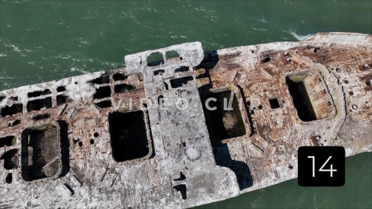 CLIP 14 - Kiptopeke Concrete Ships, VA looking down on ship as pelican flies by