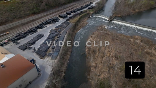 CLIP 14 - Lynchburg, VA Vol. 1 - close view of spillway dam and then factory mill on James river