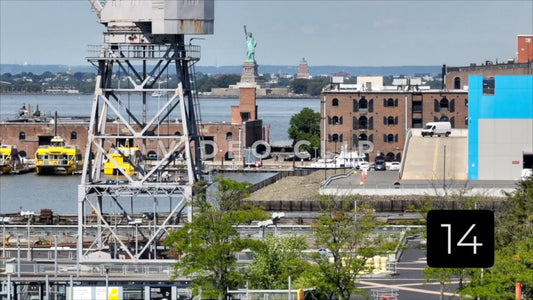 CLIP 14 - New York, NY Vol 2. - Statue of Liberty seen past cargo shipping crane on Staten Island
