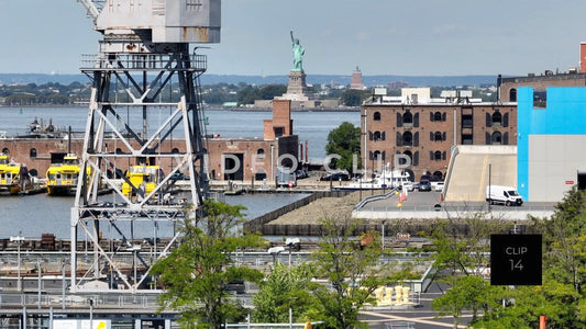 CLIP 14 - New York, NY Statue of Liberty seen past cargo shipping crane on Staten Island