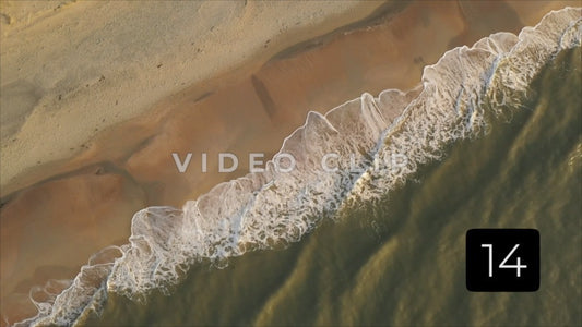 CLIP 14 - Litchfield Beach, SC looking down as waves break on the sandy shore during morning