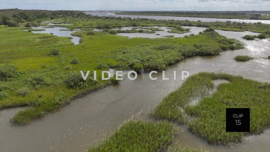 CLIP 15 - St Augustine, Florida low flight over tidal marsh with sunlight on water