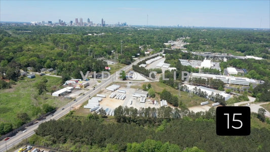 CLIP 15 - Atlanta, GA Vol. 1 - flying over industrial complex towards city skyline