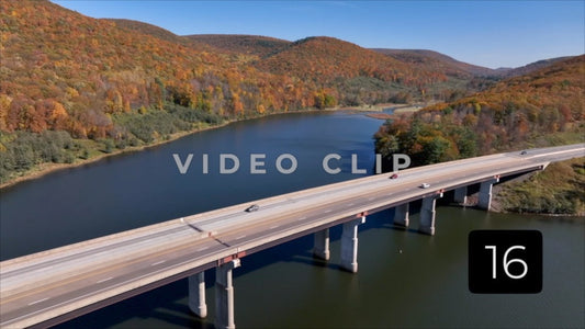 CLIP 16 - Tioga Dam and Reservoir, PA flying over bridge as cars drive over reservoir