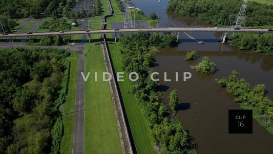CLIP 16 - New Orleans, LA Aerial following Flood wall beside bayou