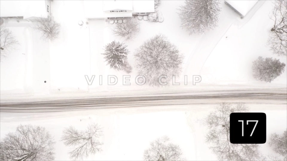 CLIP 17 - Winter Vol. 4 - Homes and street in Winter snow as car passes by