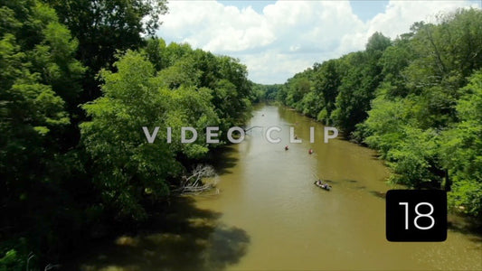 CLIP 18 - Flint River - Aerial above people in canoes paddling down river at Woodbury, GA