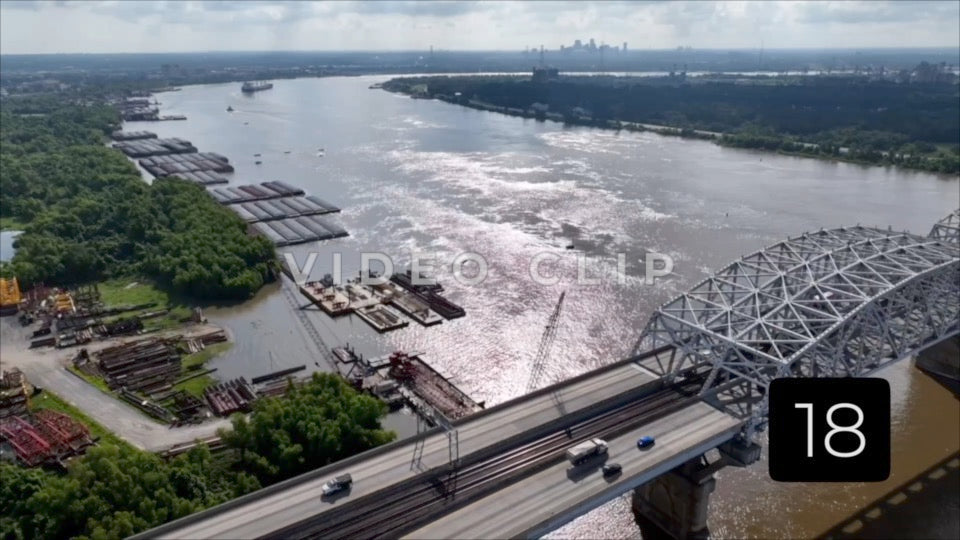 CLIP 18 - New Orleans, LA Vol. 2 - morning light on Mississippi River as traffic crosses Huey P. Long Bridge