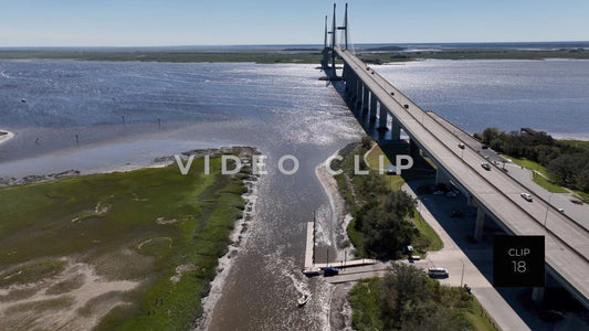 CLIP 18 - Brunswick, GA aerial turn while focusing in Sydney Lanier Bridge and boat landing