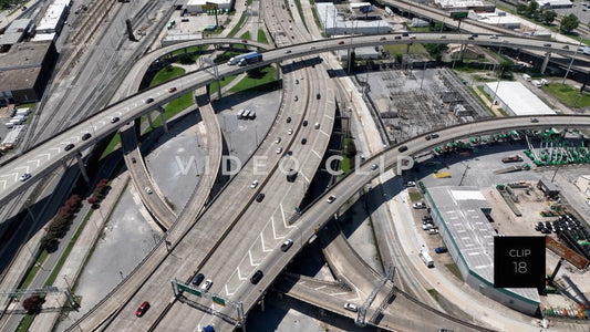 CLIP 18 - New Orleans, LA looking down on cars and trucks traveling on highway interchanges